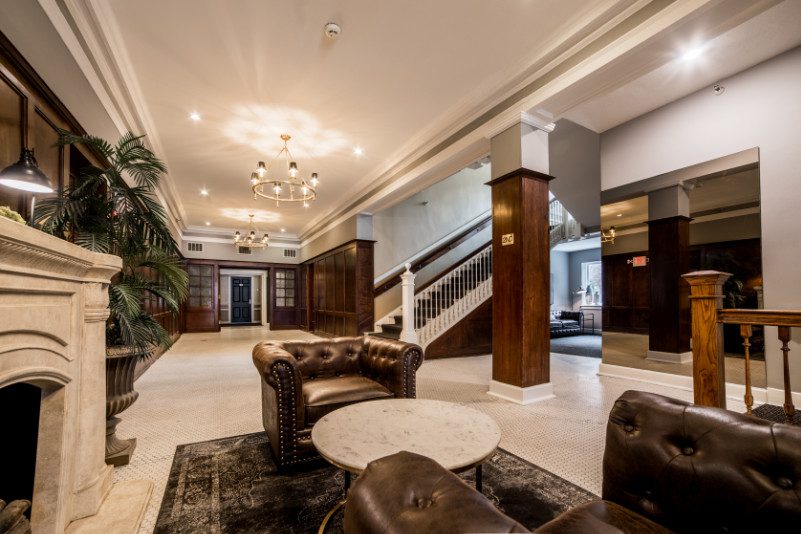 beautiful upscale lounge area with large staircase